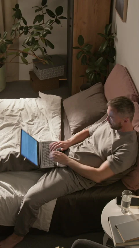Vertical Time Lapse of Daily Routine of Man Working on Laptop from Home Stock Footage 314840458