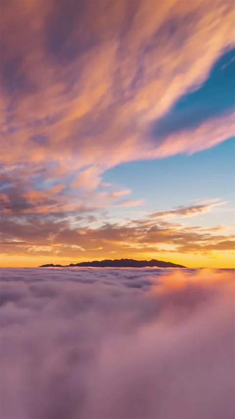 Vertical Time Lapse of Dreamy Misty Clouds in Mountains at Golden Sunset Stock Footage 313196965