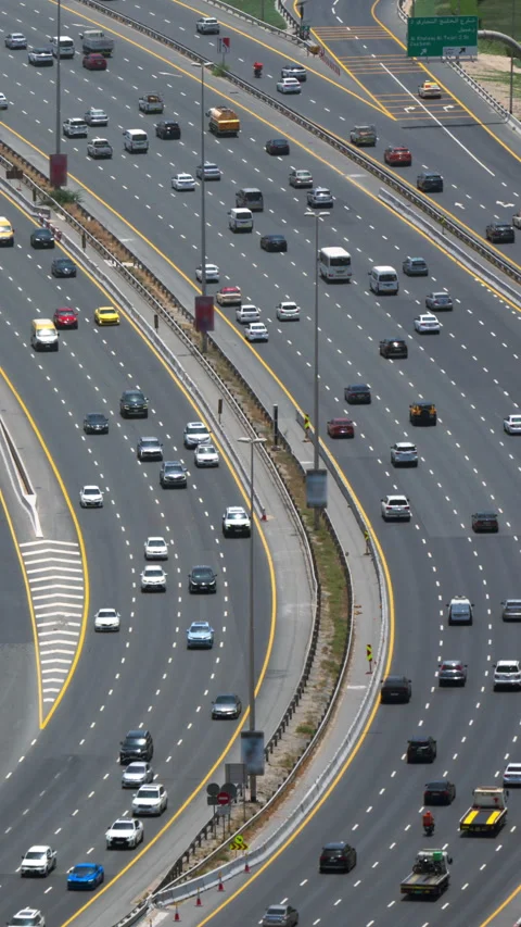 Vertical time lapse of highway traffic in Dubai, cars on multi lane road Stock Footage 340432888