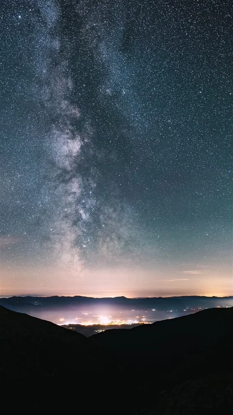 Vertical Time lapse of milky way galaxy stars in night sky over countryside Stock Footage 265189601