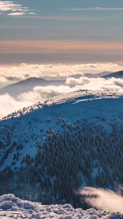 Vertical Time Lapse of Misty Clouds in Frozen Winter Mountains Stock Footage 313210681