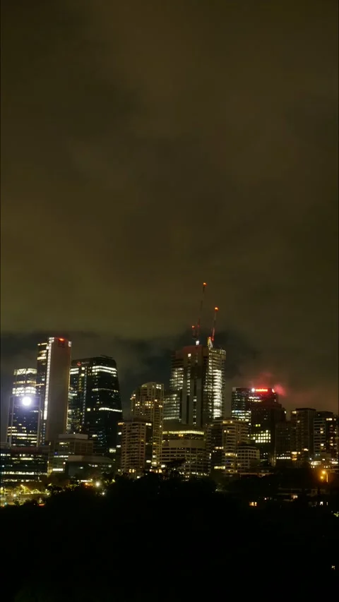 Vertical time lapse neon skyscrapers and big clouds in Sydney CBD 4K Video stock 309070019