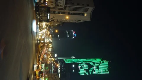 Vertical time lapse of night city traffic. High towers on a background.  Video stock 119540787