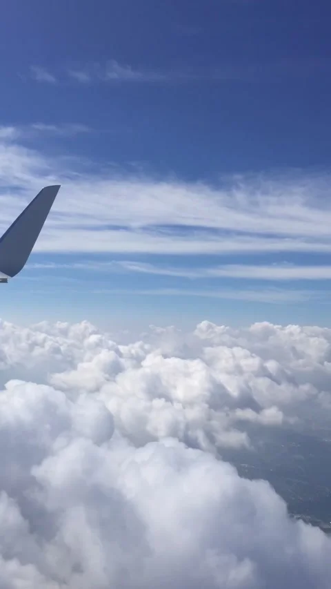 Vertical time lapse out plane window with clouds and wing tip. Stock Footage 165065728