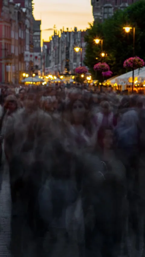 Vertical time lapse Pedestrian evening street with blurred walking people and Video stock 253283196