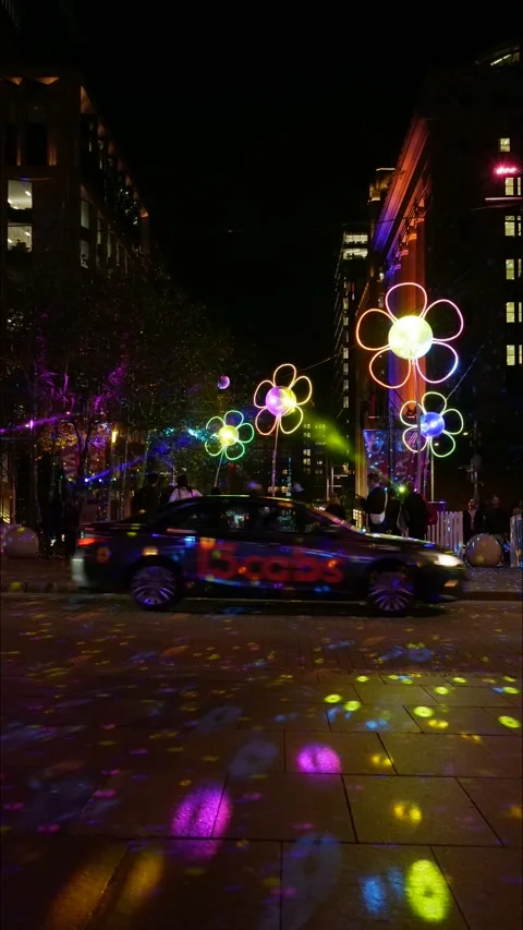 Vertical time lapse pedestrians and traffic and VIVID Sydney street 4K Stock Footage 310485138