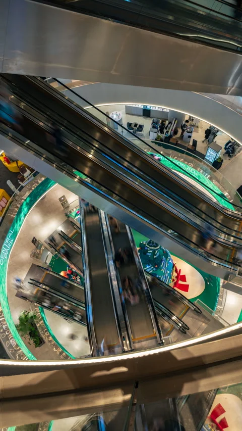 Vertical time-lapse of people in the escalators of Dustin Central Park in Stock Footage 328350841
