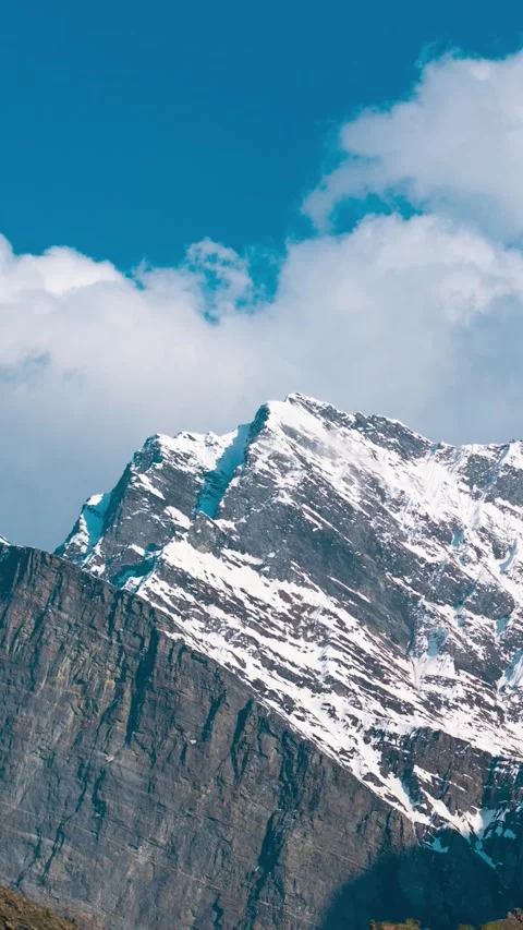 Vertical Time-lapse shot of clouds above the snow covered Himalayan mountain  Stock Footage 281066244