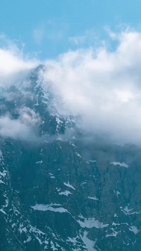 Vertical Time Lapse shot of monsoon clouds rolling around the snowy Himalayas Stock Footage 281066167