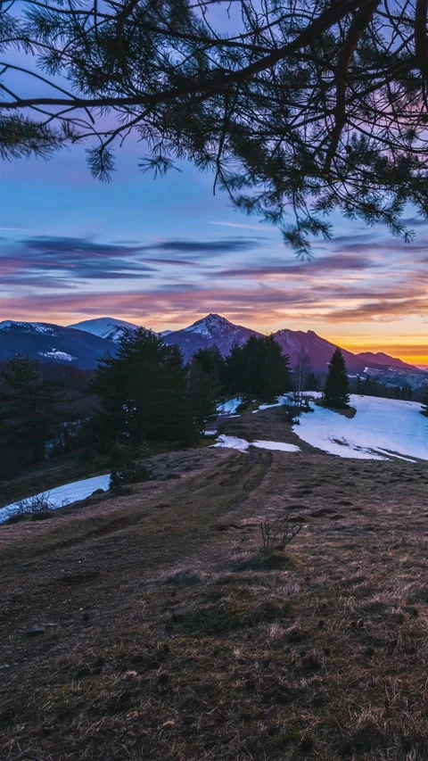 Vertical Time lapse of spring alpine mountais country at beautiful sunset under Stock Footage 236759069