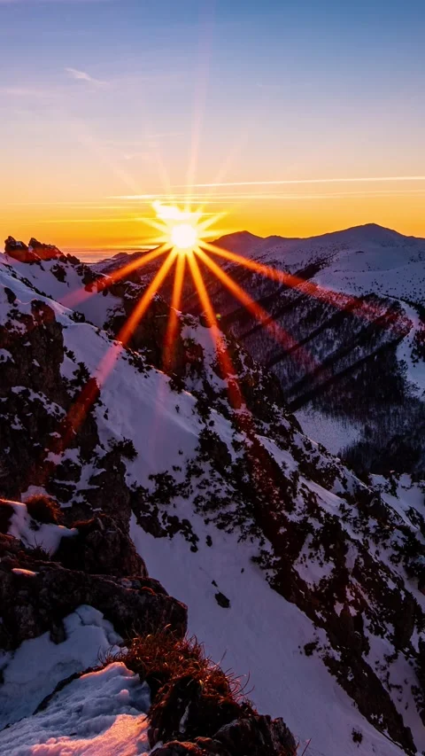 Vertical Time Lapse of Sunrise in Winter Mountains Landscape with Golden Light Stock Footage 310668116