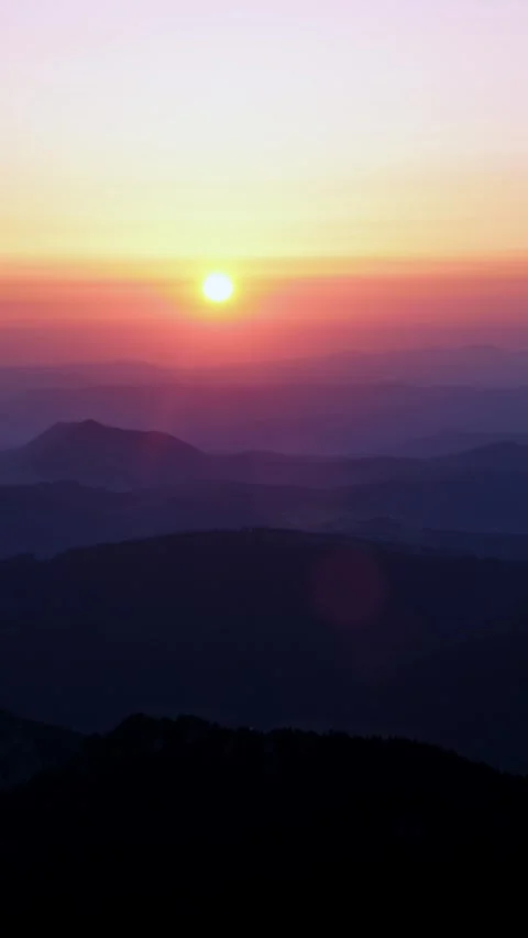 Vertical Time-lapse of a Sunset Over a Mountain Landscape Stock Footage 317765206