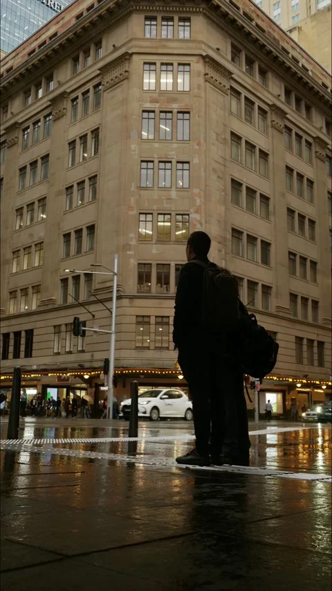 Vertical time lapse Sydney pedestrians with umbrellas in the city 4K Stock Footage 308353023