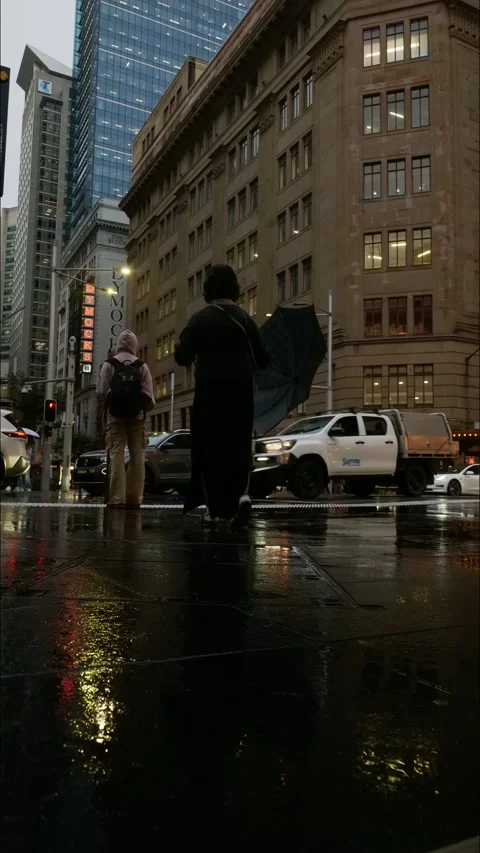 Vertical time lapse Sydney tram and pedestrians on rainy evening 4K Stock Footage 308366307