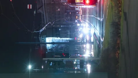 Vertical time-lapse traffic jam on busy crossroad, trams moving fast in evening Stock Footage 166756461