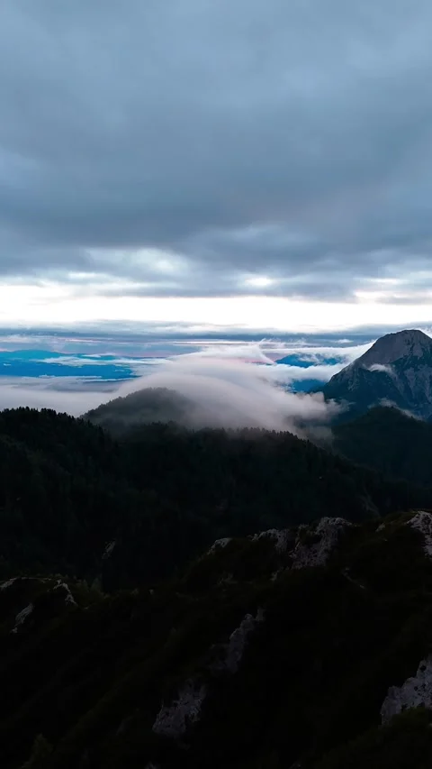 Vertical Timelapse Above Mountain Clouds During Dramatic Sunrise Stock Footage 346744533