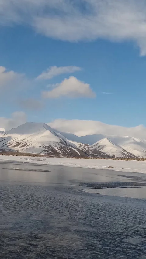 Vertical Timelapse of Arctic Sea Ice and Snow Covered Mountains in Svalbard Stock Footage 340037100