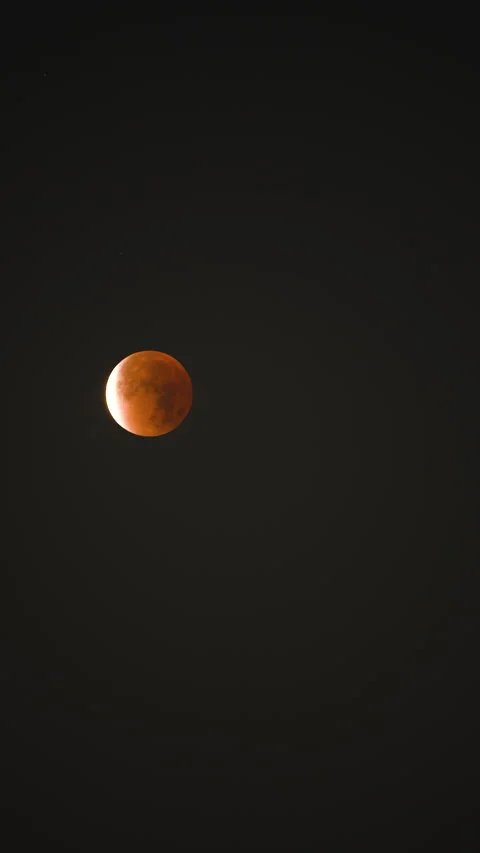 Vertical Timelapse of Blood Moon Lunar Eclipse in Dark Night Sky Stock Footage 332967735