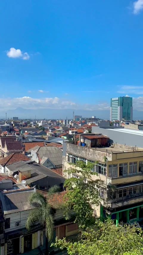 Vertical Timelapse of Blue Sky and Moving Clouds Above Urban Cityscape Stock Footage 337690296