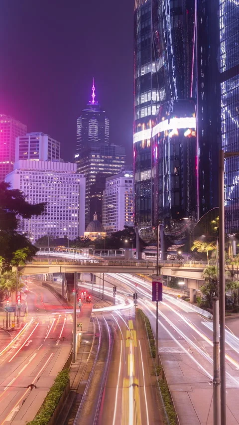 Vertical timelapse of Central Hong Kong traffic and illuminated skyscrapers Stock Footage 344372264