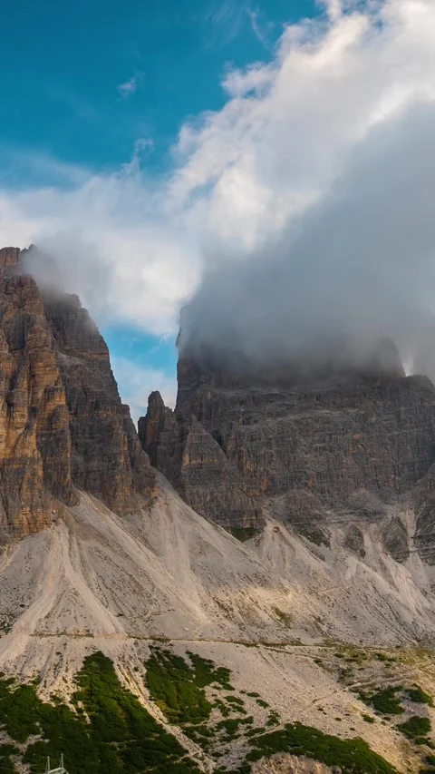 Vertical Timelapse of Clouds and Shadows Moving Around Peaks of Italian Alps Stock Footage 342031542