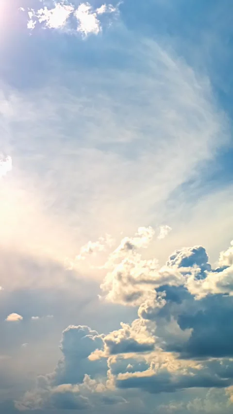 Vertical Timelapse of Clouds Morphing Beside Bright Sun Stock Footage 339639933
