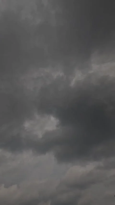 Vertical timelapse of dark black clouds moving fast. Video stock 320105416