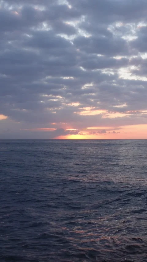 Vertical timelapse of dawn between clouds at ocean Stock Footage 296489054