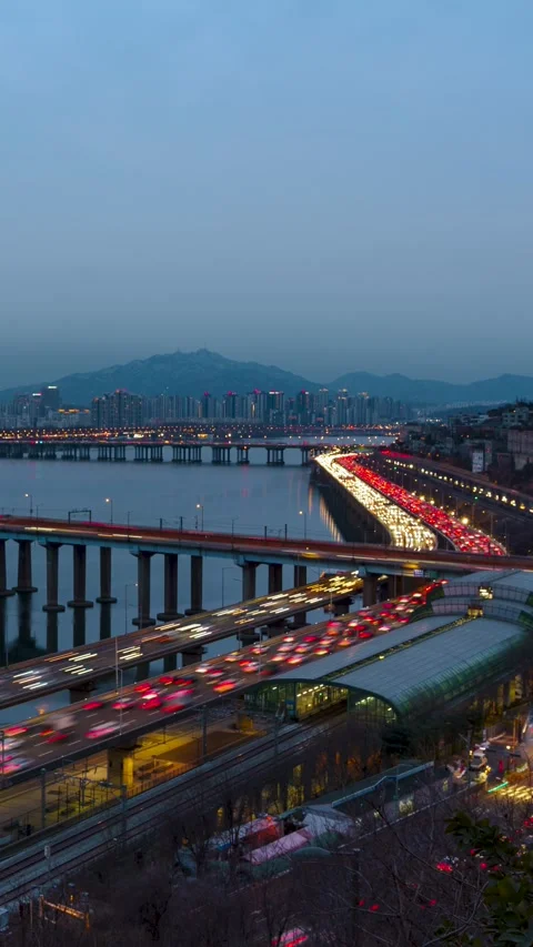 Vertical Timelapse Day to Night Rush Hour Traffic on Gangbyeonbuk-ro Dongho Stock Footage 331062595