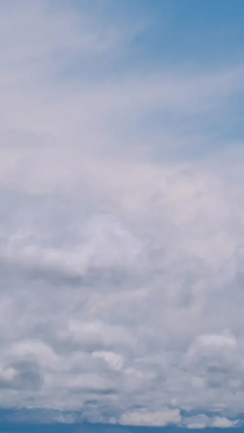 Vertical Timelapse of Dense Layered Clouds Drifting Across Sky Stock Footage 310806412