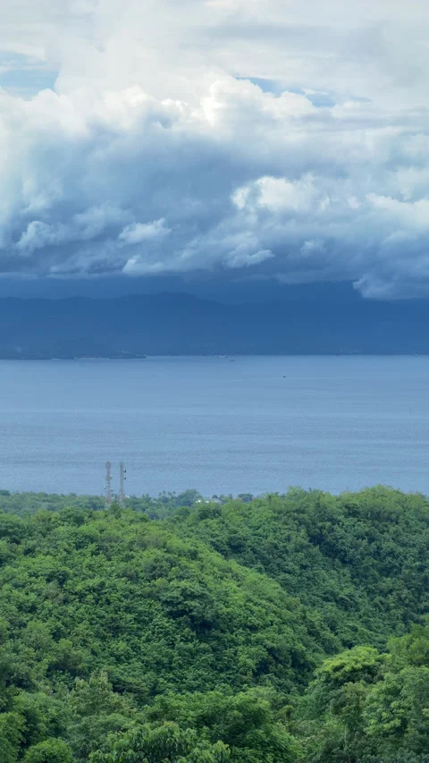 Vertical timelapse of dramatic clouds over ocean between Nusa Penida and Bali, I Stock Footage 329668793