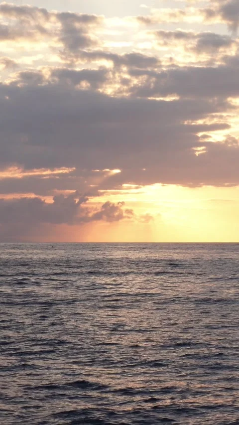 Vertical timelapse of early sun between clouds at ocean Stock Footage 283276695