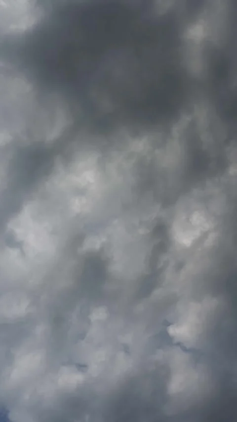 Vertical timelapse of gray to white storm clouds churning in a summer sky Stock Footage 311285344