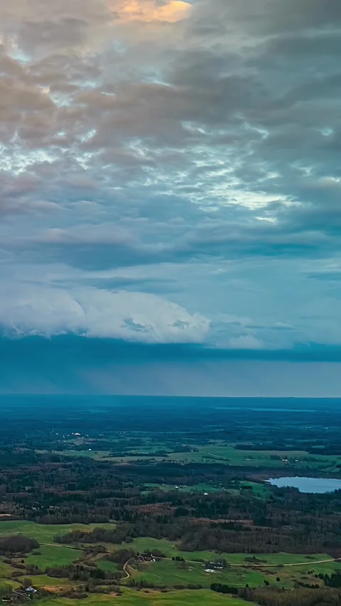Vertical Timelapse Of Moving Storm Clouds Over Countryside Lativa At Dusk Stock Footage 341839916