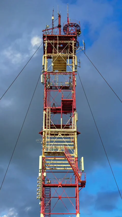 Vertical Timelapse of Red Industrial Tower Against Blue Sky Stock Footage 337689238