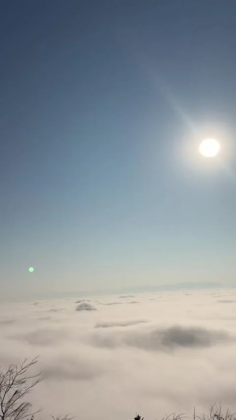 Vertical Timelapse of Rolling Sea of Clouds under Bright Sun from Mountain P Stock-Footage 326079922