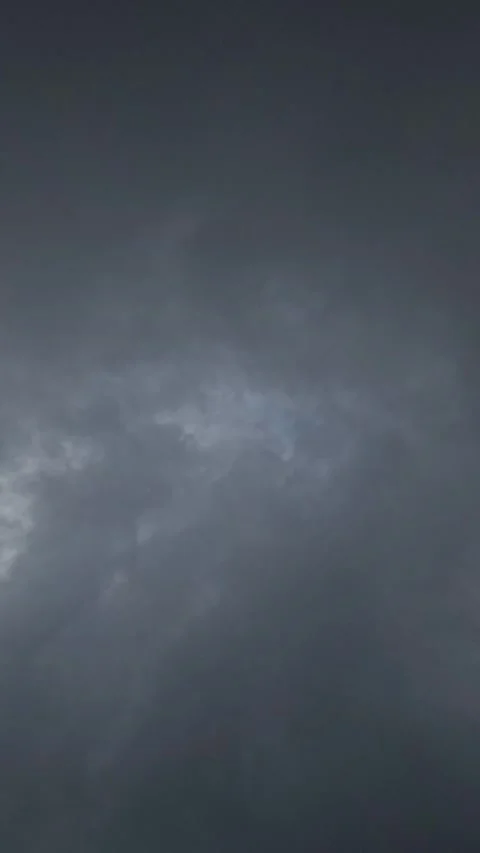 Vertical timelapse of soft dark black clouds during the day. Stock Footage 320984607
