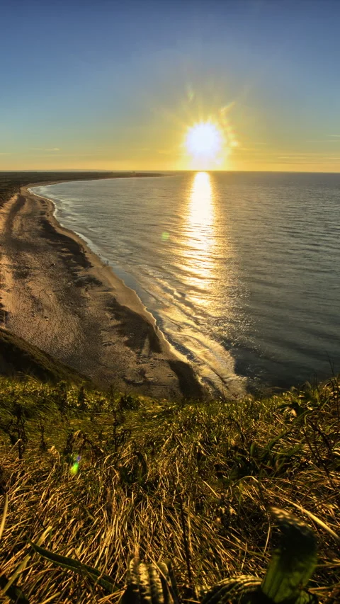 Vertical Timelapse sun setting over summer beach and sea at high view point Stock Footage 280179673