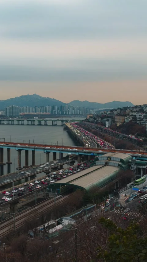 Vertical Timelapse Sunset Rush Hour Traffic on Gangbyeonbuk-ro Expressway Near Stock Footage 331033526