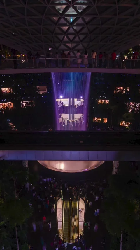 Vertical timelapse view of indoor waterfall at The Jewel Changi while a vor.. Stock Footage 229751355