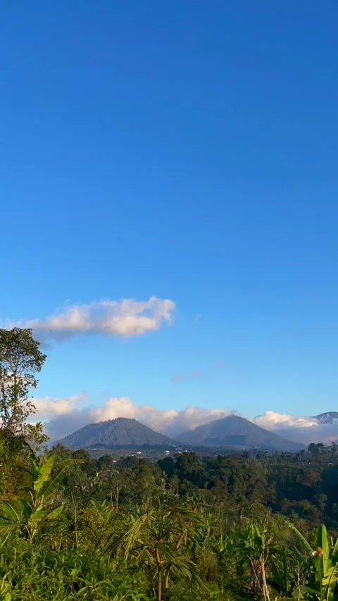 Vertical Timelapse View of Moving Clouds Over Mountain Range in Bali Stock Footage 341809133