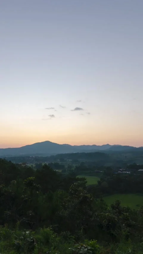 Vertical timelapse  view of Sunset in over natural winter mountain range wi.. Stock Footage 228716972