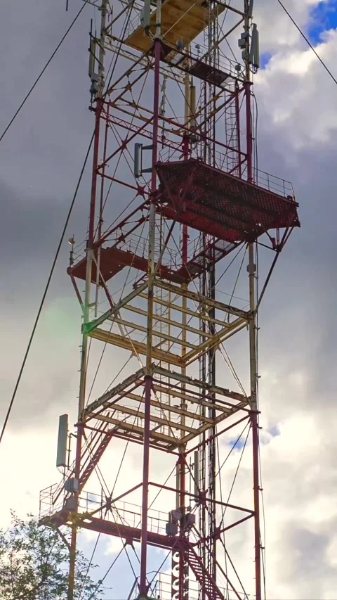 Vertical Timelapse with Zoom In on Red Industrial Communication Tower Stock Footage 337689244
