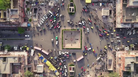 Vertical Top angle aerial drone shot of roundabout with moving vehicles in city. Stock Footage 249836490
