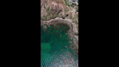 Vertical Top-Down Aerial of Clear Turquoise Water and Rocky Shore at Eo Gio Stock Footage 322223874