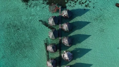 Vertical Top Down Aerial Drone Shot of Abandoned Overwater Bungalows Pier and 스톡 동영상 345001685