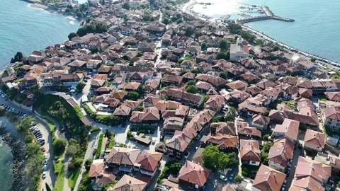 Vertical top-down aerial view over the dense rooftops of ancient Nesebar. Stock Footage 327672396