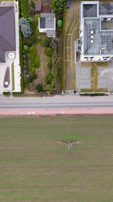 Vertical Top Down Drone Tracking Truck Between Suburban Houses And Field Stock Footage 330750662