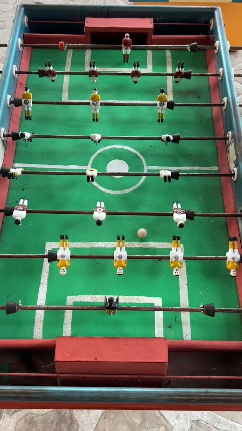 Vertical top-down shot of rustic Mexican futbolito table match Nautla Veracruz Stock Footage 314976886