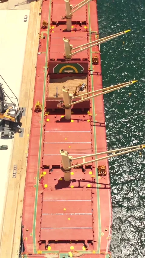 Vertical Top Down View Of Bulk Cargo Ship Moored At Dock Stock Footage 339033367